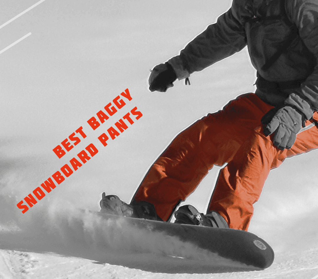 A snowboarder wearing baggy pants mid-air against a snowy mountain backdrop